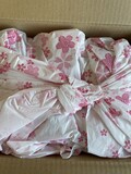 可愛い桜の風呂敷に包まれています。